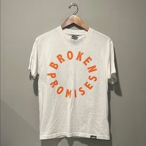 Broken Promises Orange and White Short Sleeve Tee with Circular Text Design